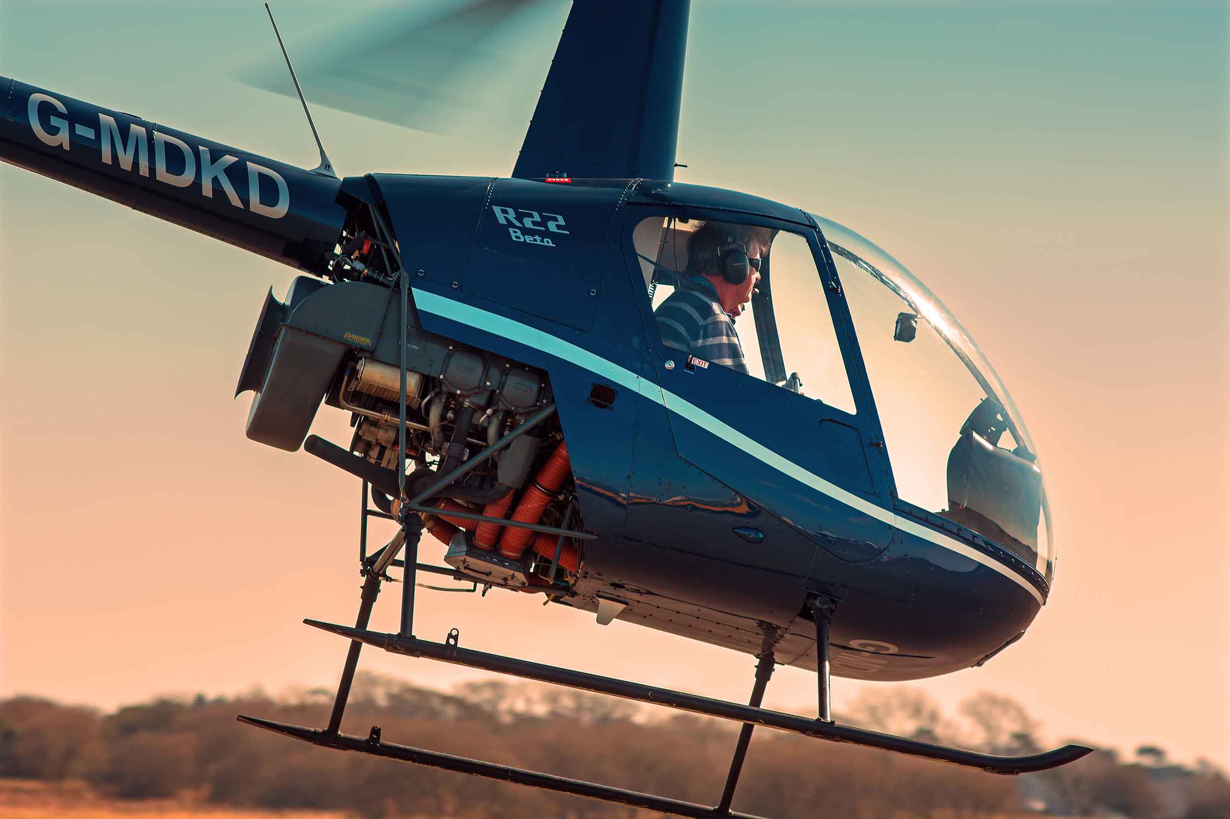 The magic of flying a helicopter! This could be you flying this two-seat Robinson R22